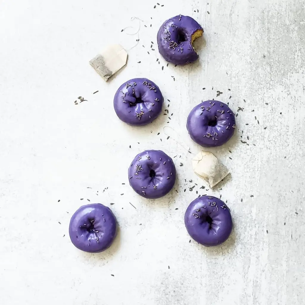 Iced vanilla donuts with glaze and sprinkles — Sugar Face Bakes