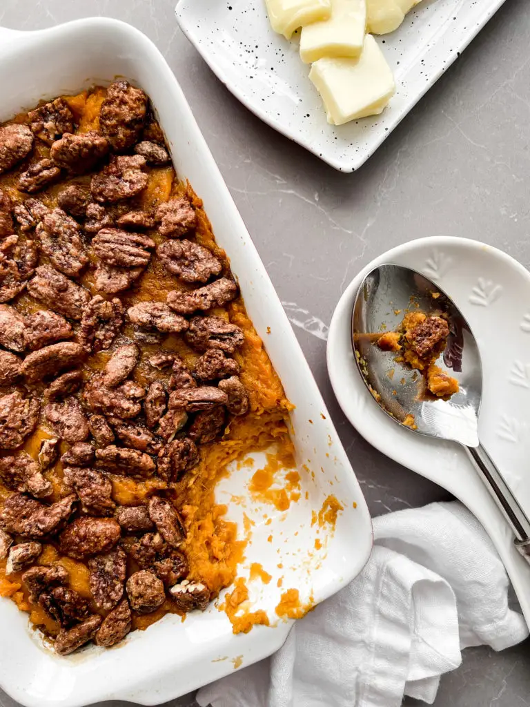 Sweet Potato Casserole fresh out of the oven with caramelized pecans and drizzled browned butter