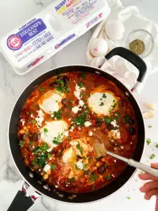shakshuka- 10-Minute Shakshuka Traditional Shakshuka in a skillet with poached eggs, crumbled feta cheese, and fresh parsley — Sugar Face Bakes