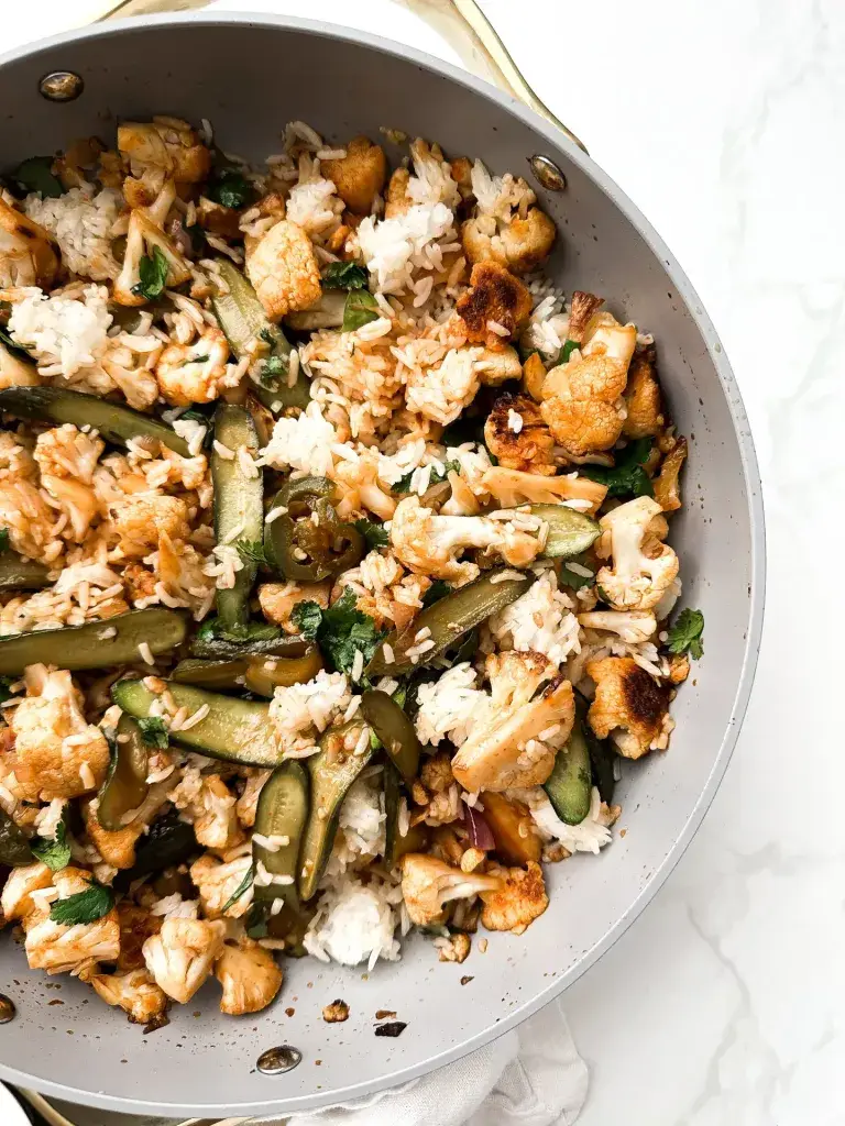 one pan vegan spicy stir fry with rice, cucumber and cauliflower — Sugar Face Bakes