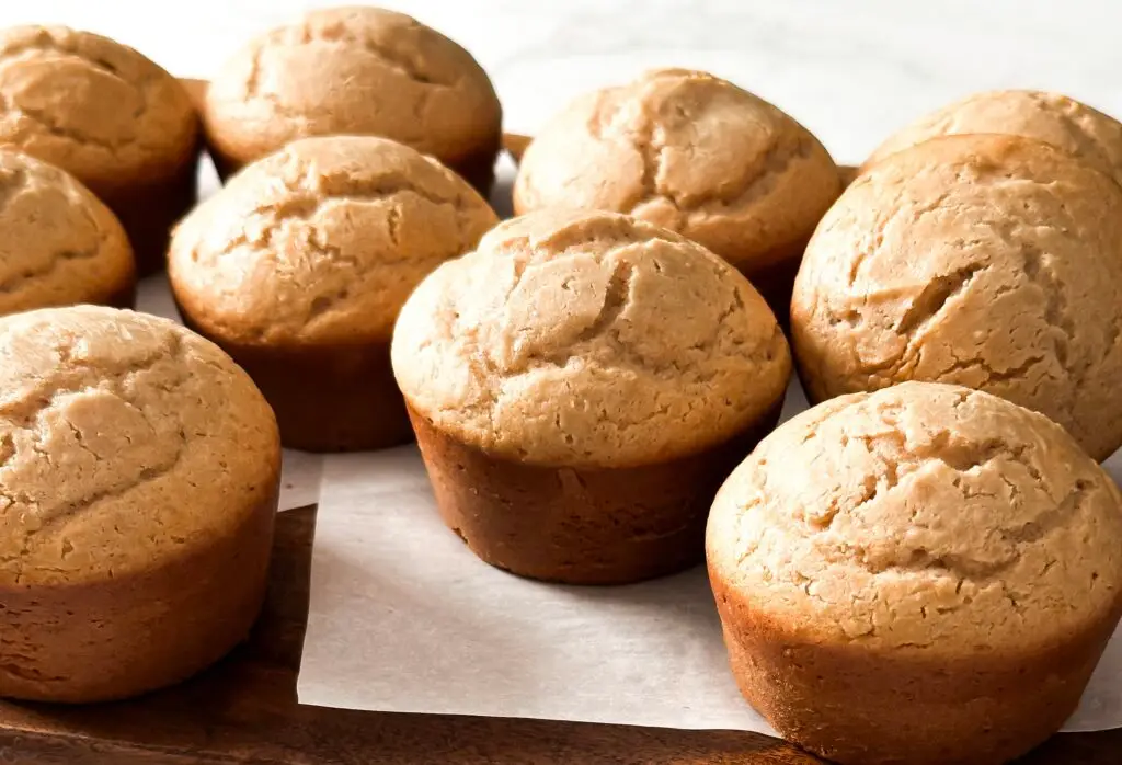 Golden brown Peanut Butter Banana Muffins with a moist crumb served on a cooling rack — Sugar Face Bakes
