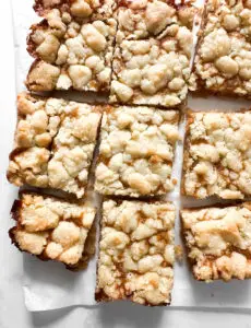 Shortbread cookie bars sliced in pan — Sugar Face Bakes