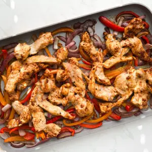 sheet pan chicken fajitas- Sheet Pan Chicken Fajitas Chicken fajitas on sheet pan before baking