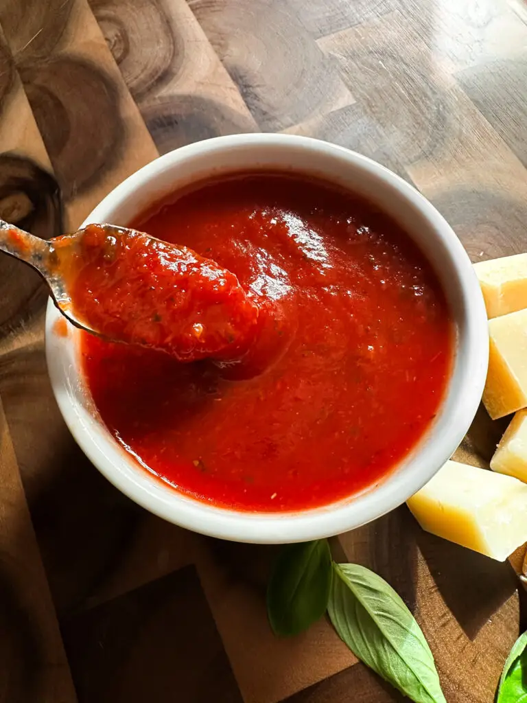 Marinara sauce cooking on stovetop