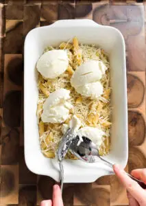 Baked ziti with ground beef in a white casserole dish — Sugar Face Bakes