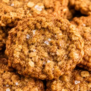 brown butter oatmeal cookies- The Best Brown Butter Oatmeal Cookies Bakery-style brown butter oatmeal cookies with warm spices and flaky sea salt stacked together, featuring chewy centers, crisp edges, and old-fashioned rolled oats.