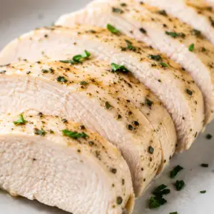 how long to boil chicken breast- How Long to Boil Chicken Breast: The Complete Guide for Juicy, Tender Chicken Juicy boiled chicken breast sliced into thick pieces and seasoned with black pepper, garlic, and fresh herbs on a plate.